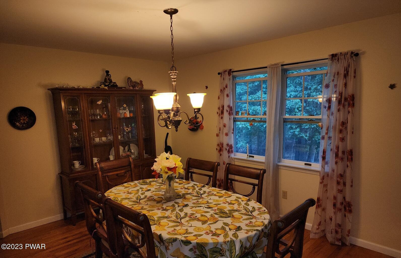 249 Pin Oak Road Stroudsburg, PA 18360 - Photo 12 of 34 a view of a dining room with furniture window and wooden floor