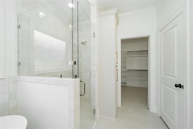 a bathroom with a granite countertop sink mirror and toilet