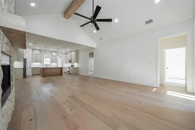 a view of a kitchen with a sink and a window