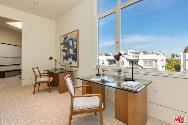a room with gym equipment and a flat screen tv
