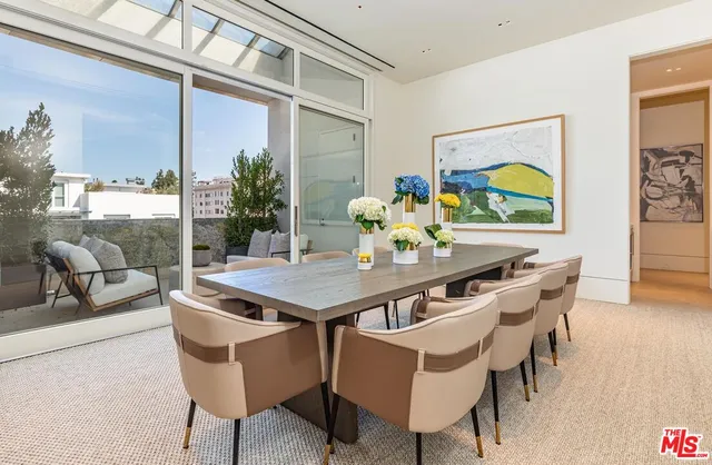 a kitchen with a table and chairs