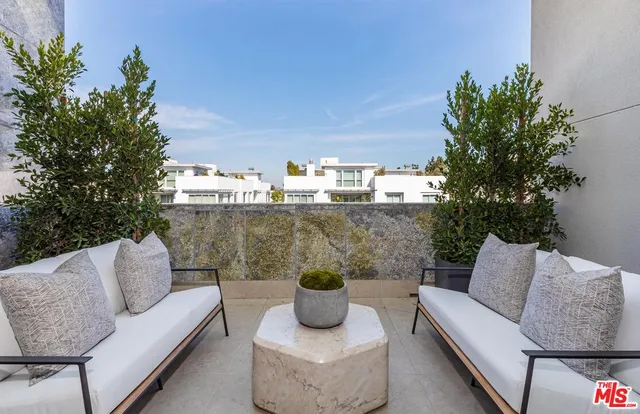 a room with a washing machine and sink