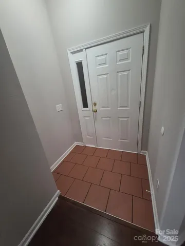 an empty room with wooden floor