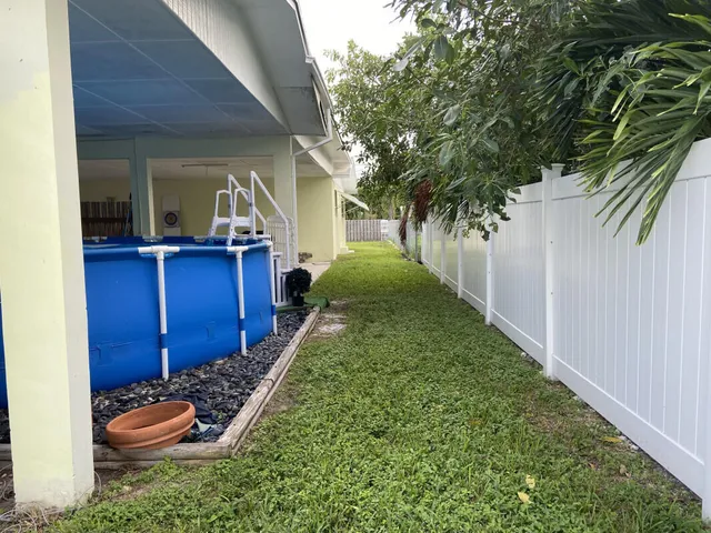 a living room with furniture a table and a fireplace