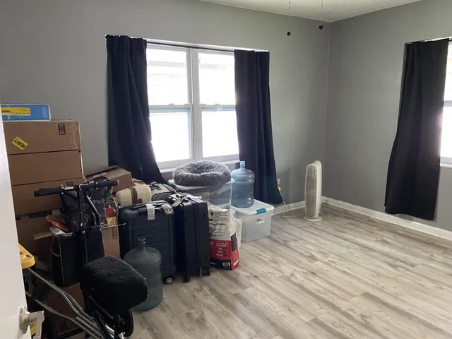 a view of workspace with wooden floor