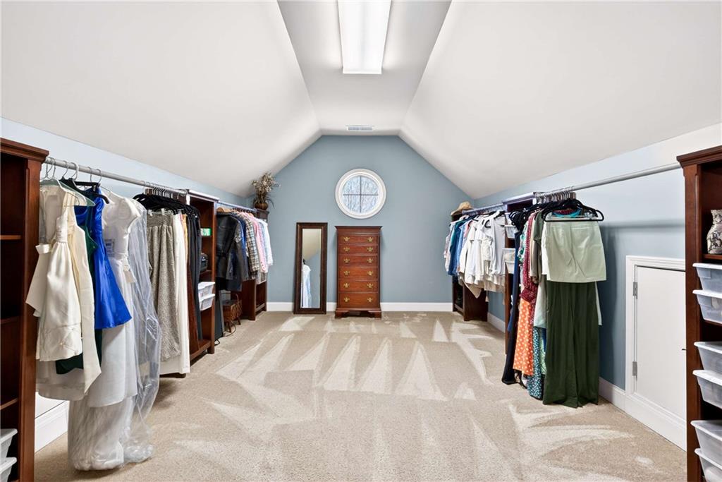 340 Scott Farm Drive Powder Springs, GA 30127 - Photo 30 of 59 a view of walk in closet with clothes and shoes