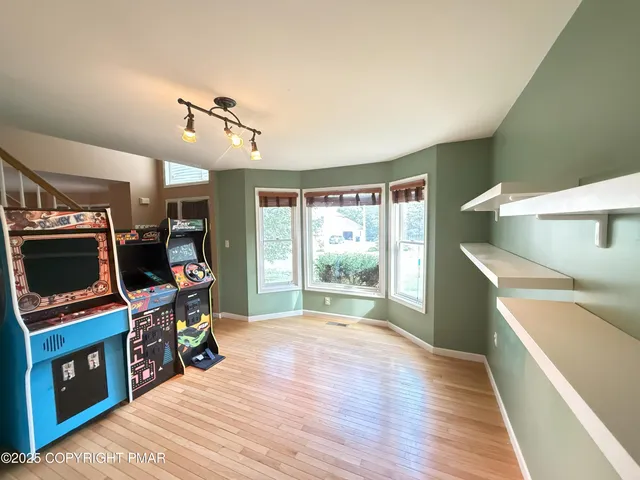a view of a livingroom with furniture and a flat screen tv