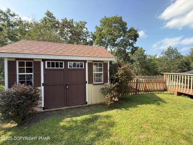 a view of house with a yard