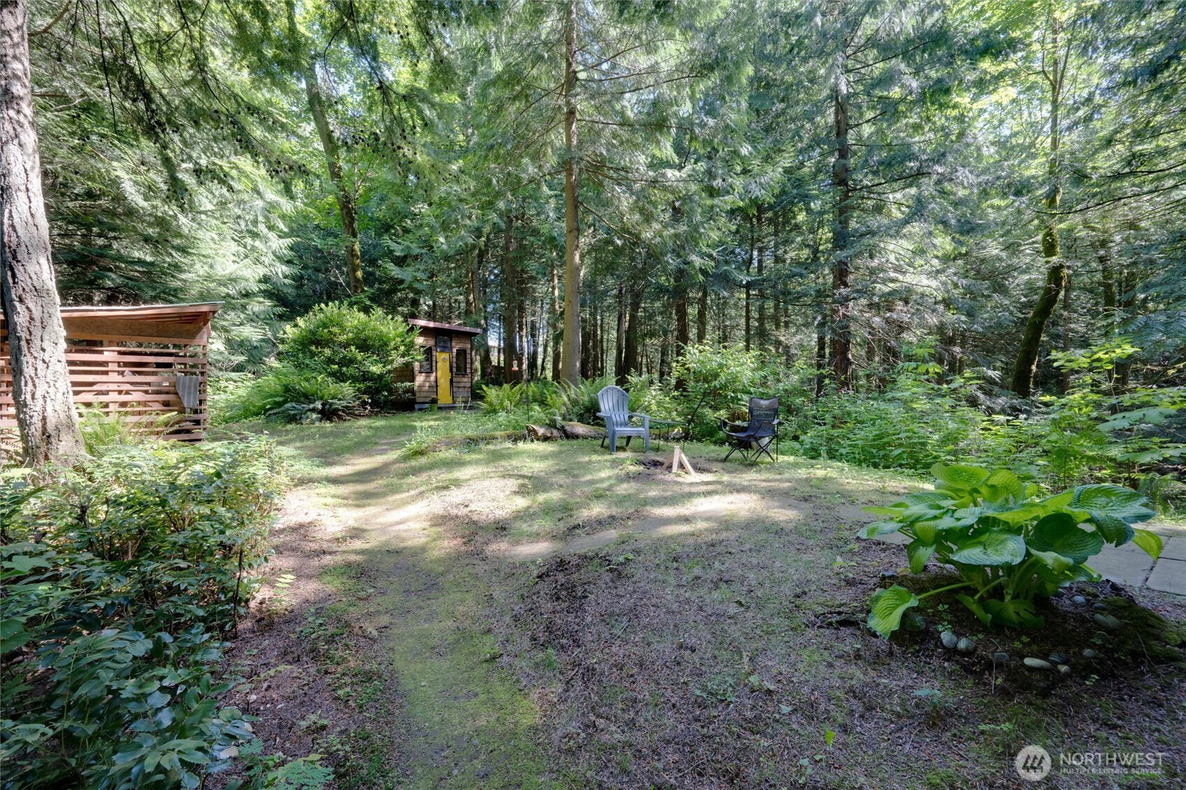 4315 Nordum Road Everson, WA 98247 - Photo 18 of 40 a view of a backyard with plants and large trees