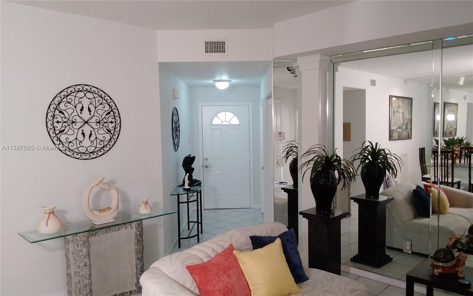 14715 Balgowan Road, Unit 1029 Miami Lakes, FL 33016 - Photo 3 of 28 a view of a livingroom with furniture and closet