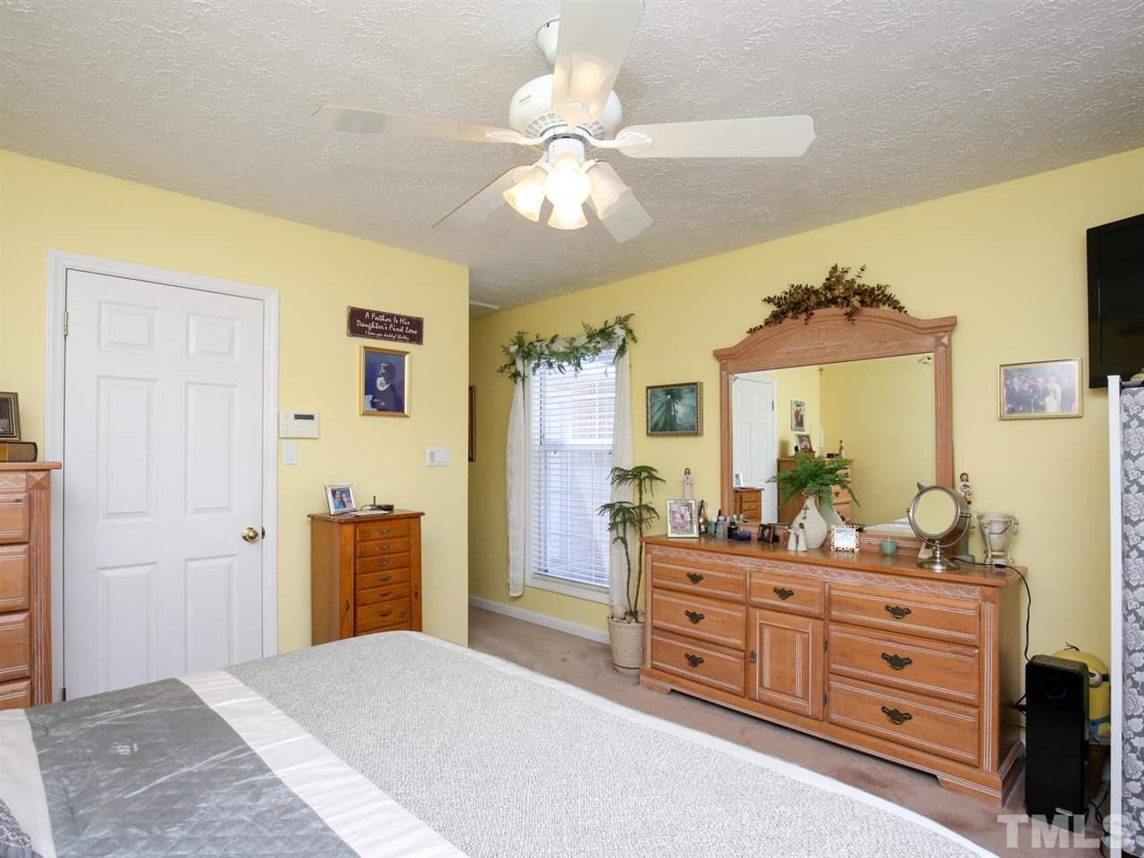 4040 Pine Ridge Road Franklinton, NC 27525 - Photo 11 of 30 a bedroom with a bed and a dresser