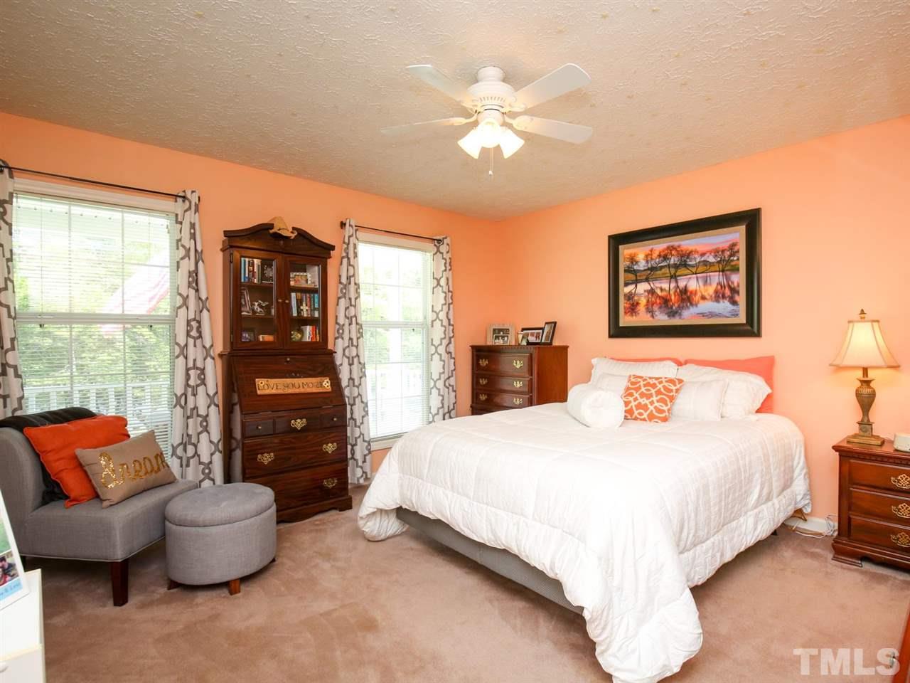 4040 Pine Ridge Road Franklinton, NC 27525 - Photo 13 of 30 a bedroom with a large bed and a couch