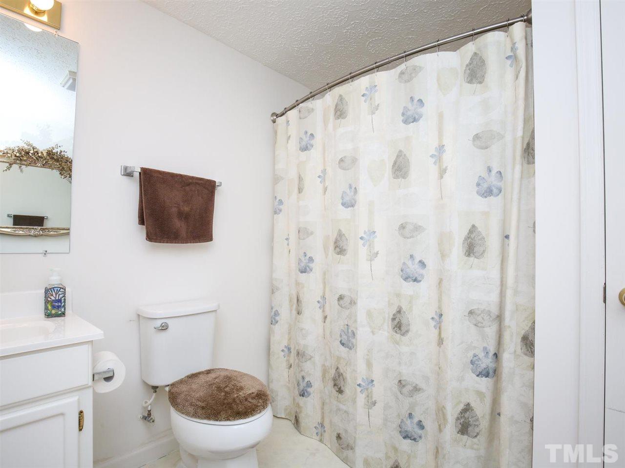 4040 Pine Ridge Road Franklinton, NC 27525 - Photo 15 of 30 a white toilet sitting next to a small bathroom sink