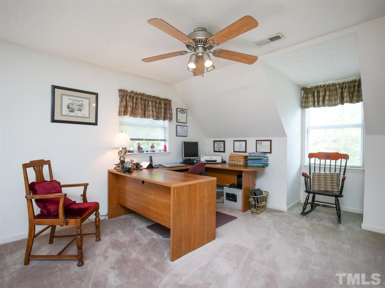 4040 Pine Ridge Road Franklinton, NC 27525 - Photo 16 of 30 a view of a workspace with furniture and a window