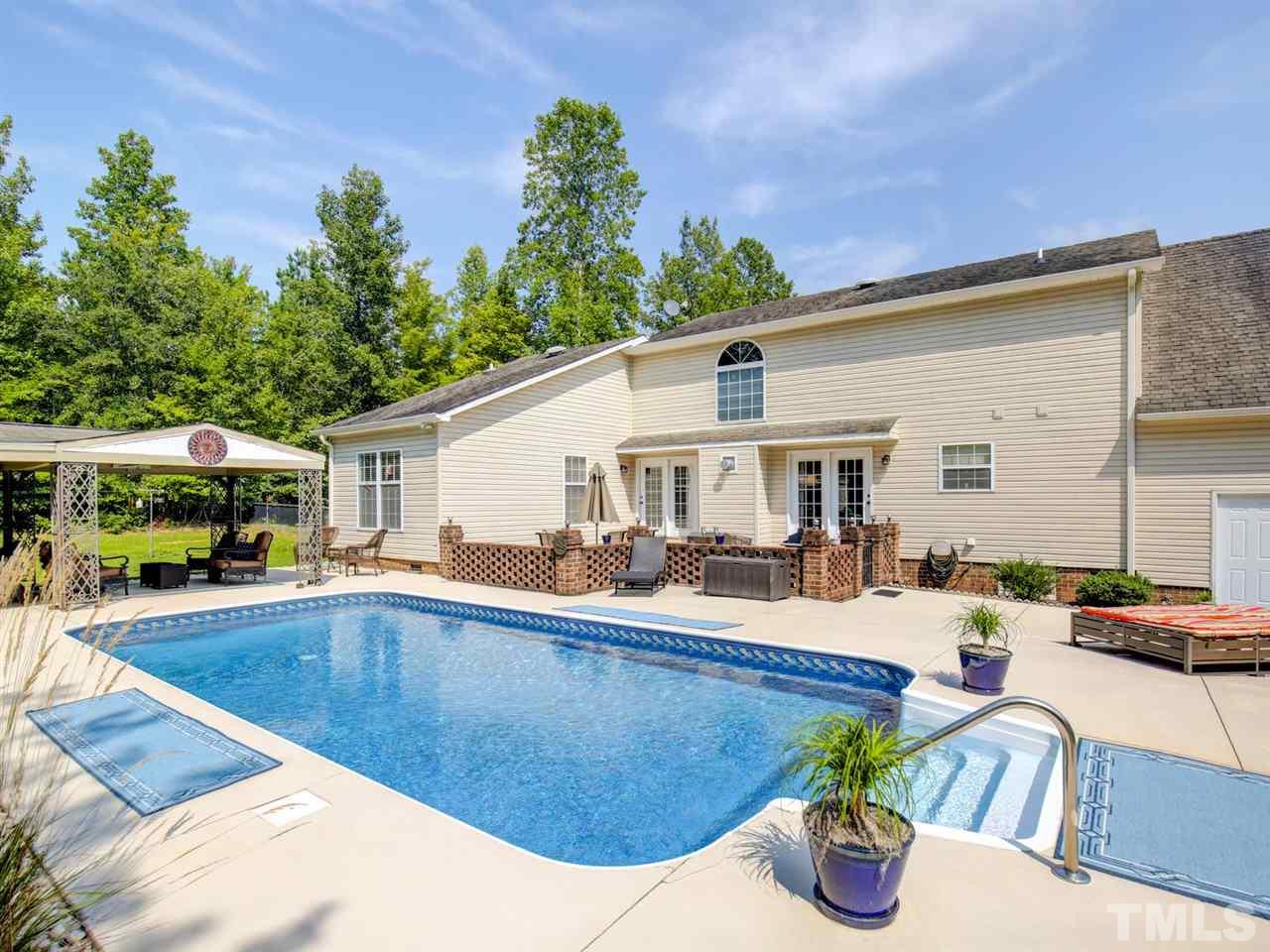 4040 Pine Ridge Road Franklinton, NC 27525 - Photo 3 of 30 a view of a house with swimming pool and sitting area