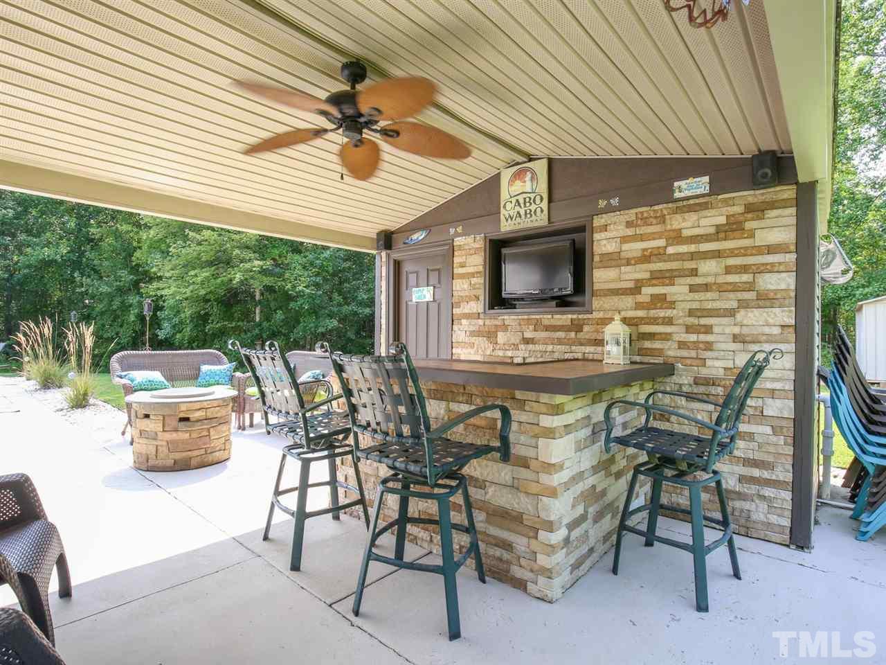 4040 Pine Ridge Road Franklinton, NC 27525 - Photo 23 of 30 a view of a patio with table and chairs and potted plants