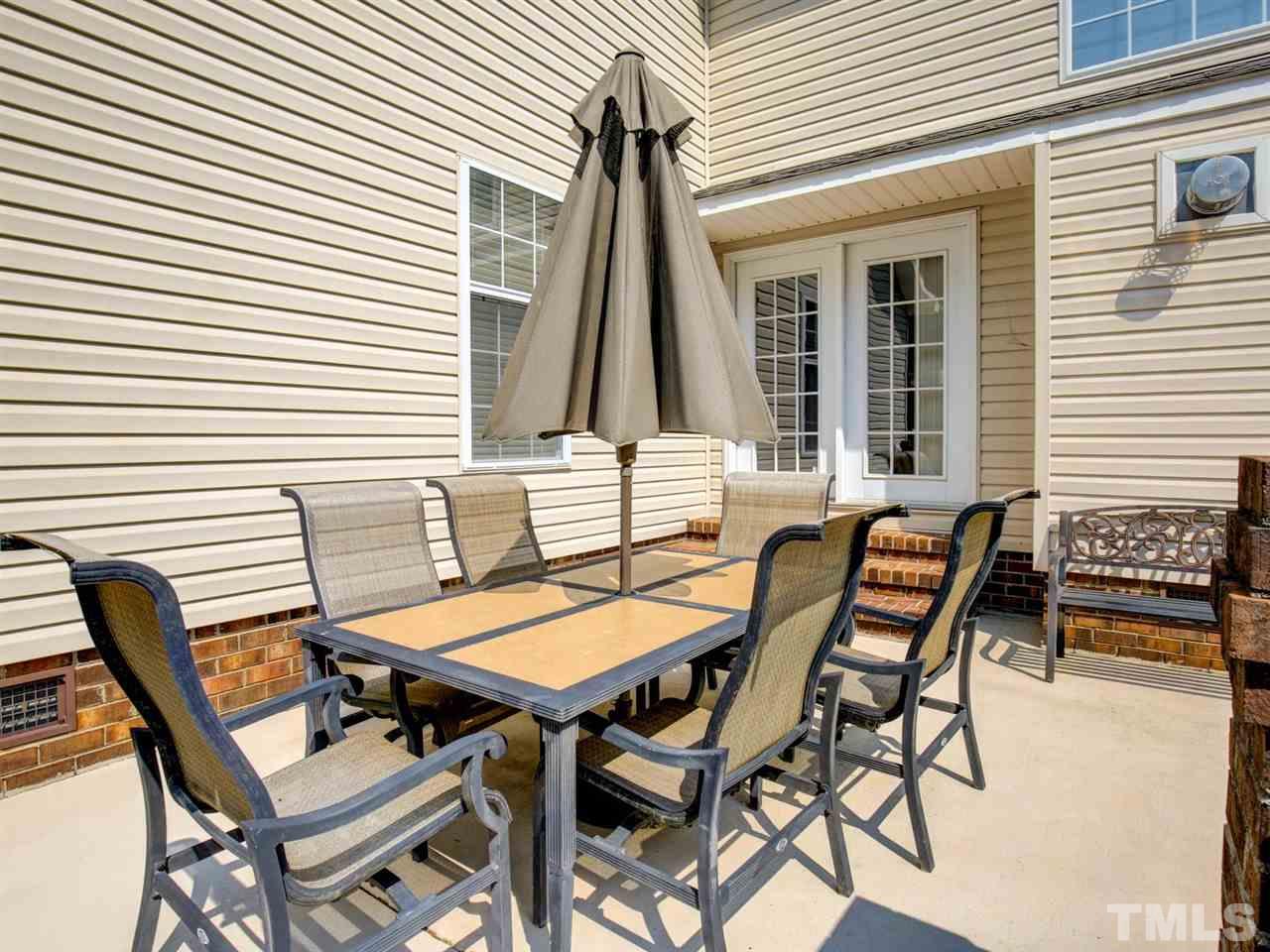 4040 Pine Ridge Road Franklinton, NC 27525 - Photo 26 of 30 a view of a patio with a table and chairs