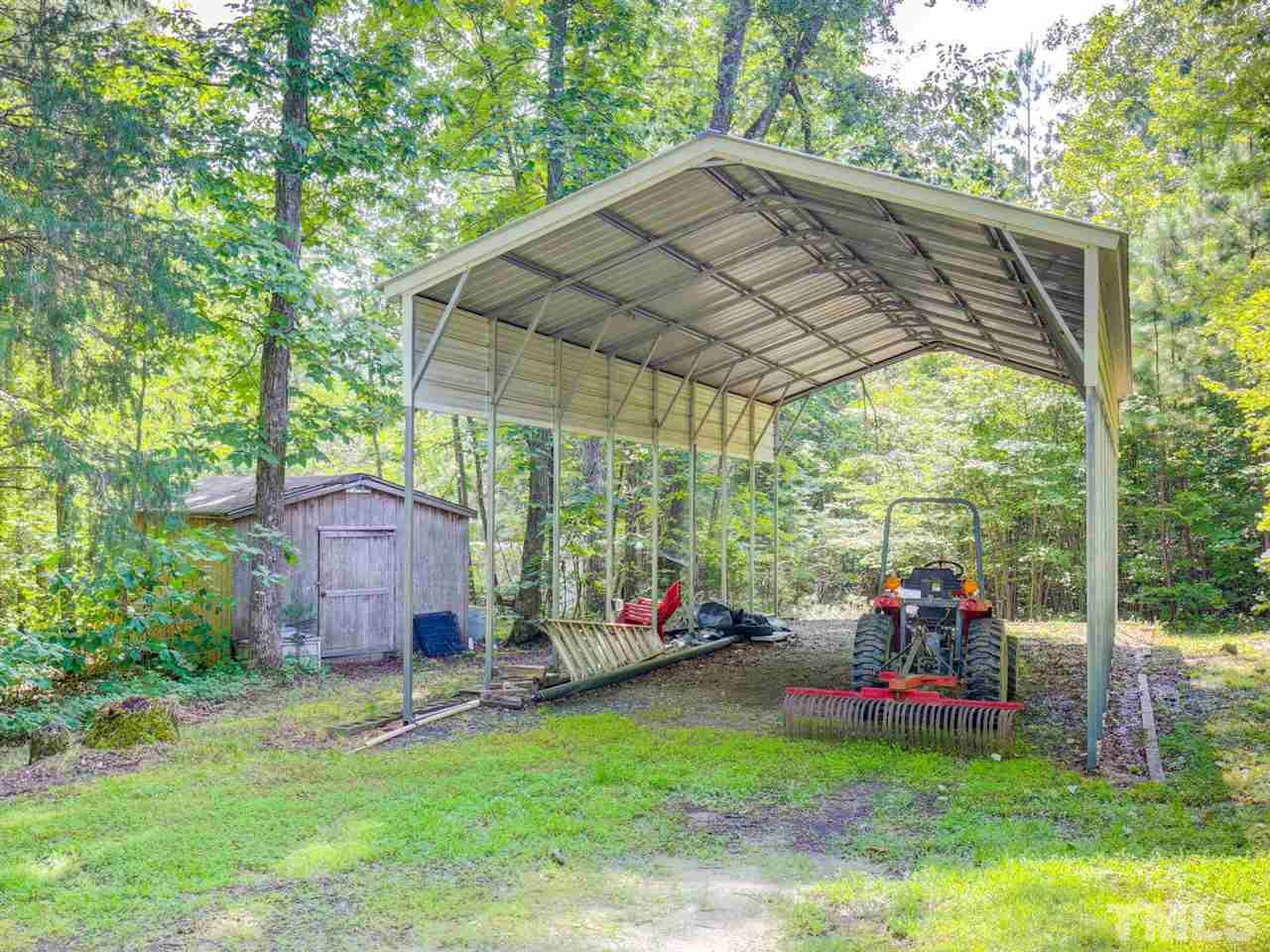4040 Pine Ridge Road Franklinton, NC 27525 - Photo 27 of 30 a view of a chair and table in backyard of the house