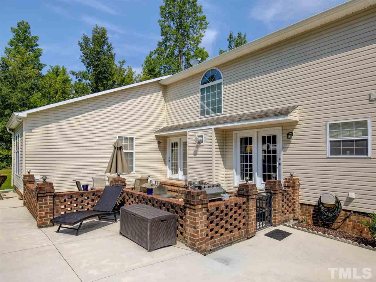 4040 Pine Ridge Road Franklinton, NC 27525 - Photo 28 of 30 a view of a patio with couches and potted plants