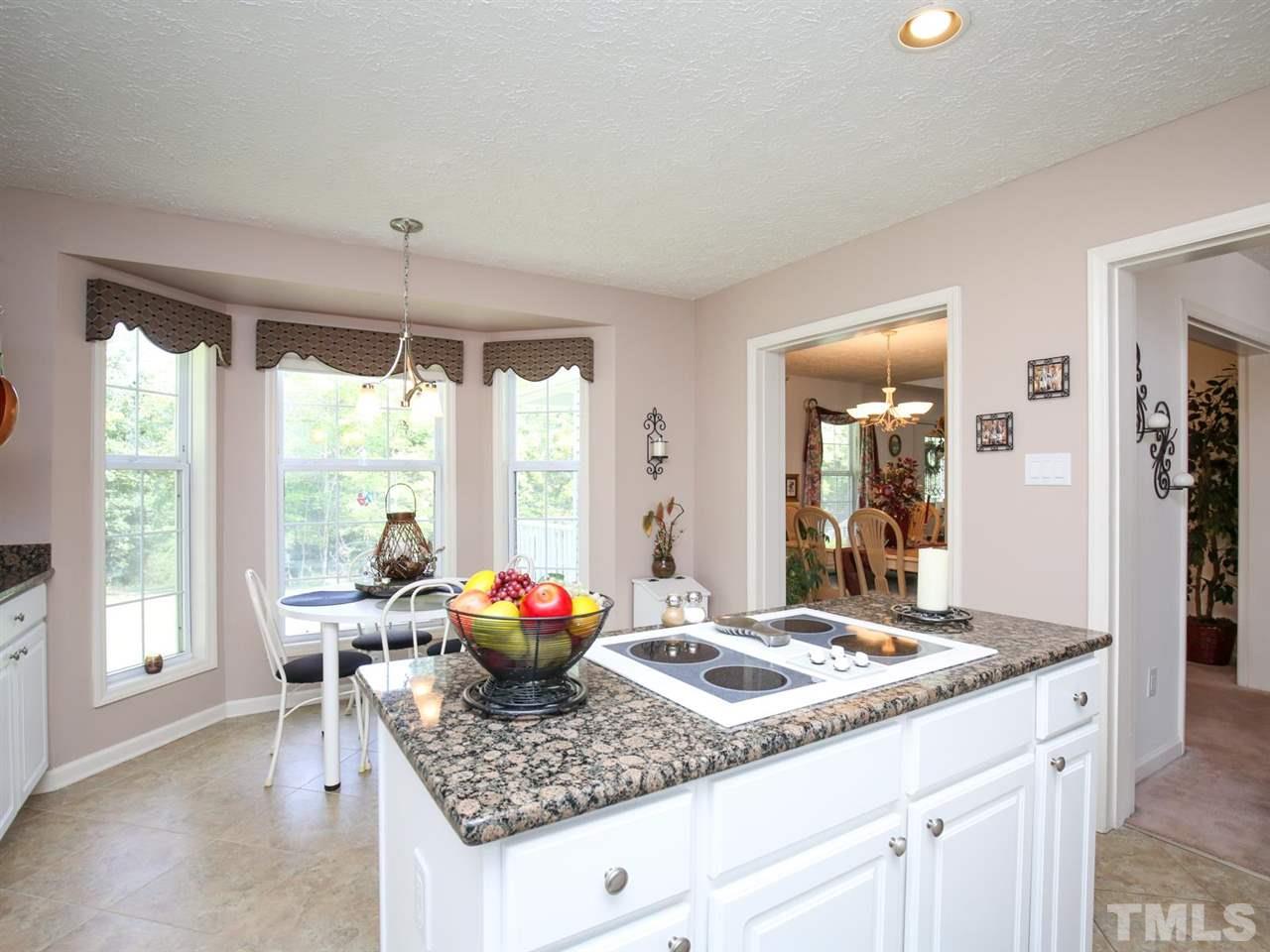 4040 Pine Ridge Road Franklinton, NC 27525 - Photo 9 of 30 a living room with granite countertop furniture and a table