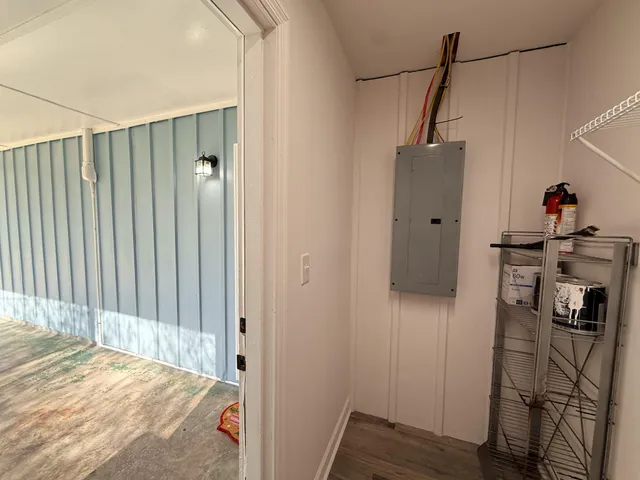 a view of hallway with wooden floor