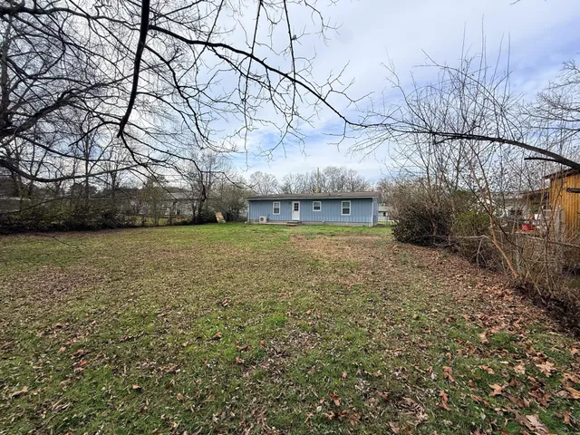 a view of a yard with an outdoor space