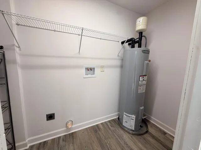 a view of storage and utility room with a washer dryer