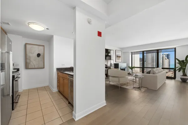a open kitchen with cabinets and stainless steel appliances