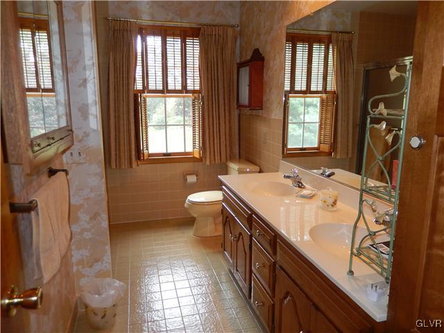 2764 Lapp Road Allentown, PA 18104 - Photo 16 of 27 a bathroom with a sink double vanity and a mirror