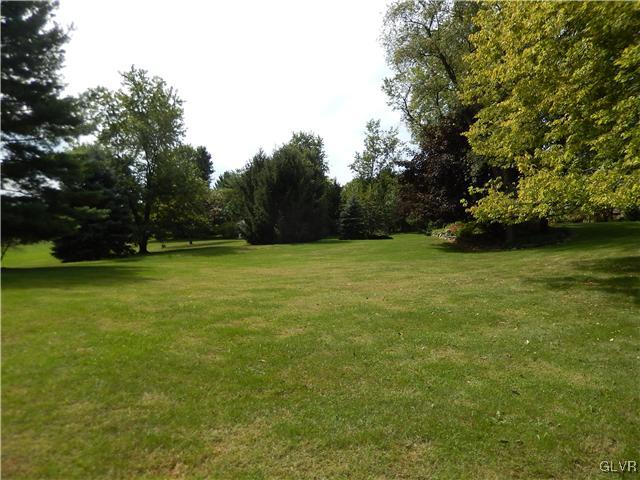 2764 Lapp Road Allentown, PA 18104 - Photo 22 of 27 a view of a green field with trees in the background