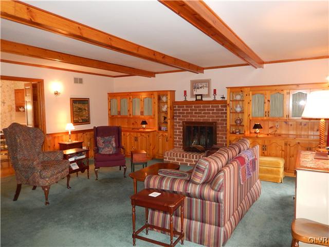 2764 Lapp Road Allentown, PA 18104 - Photo 3 of 27 a living room with furniture a fireplace and a table