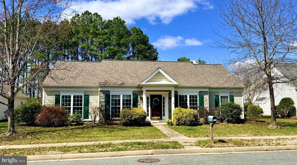 front view of a house with a garden