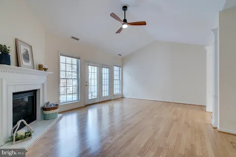a kitchen with stainless steel appliances kitchen island granite countertop a stove a sink and a microwave
