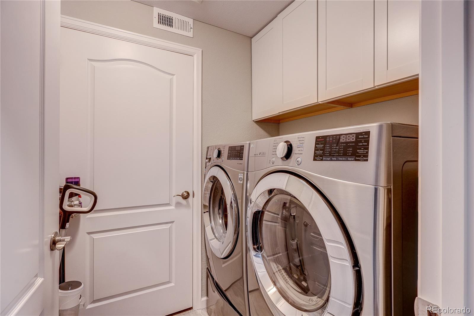 4777 Copeland Circle, Unit 204 Highlands Ranch, CO 80126 - Photo 14 of 39 a utility room with dryer and washer