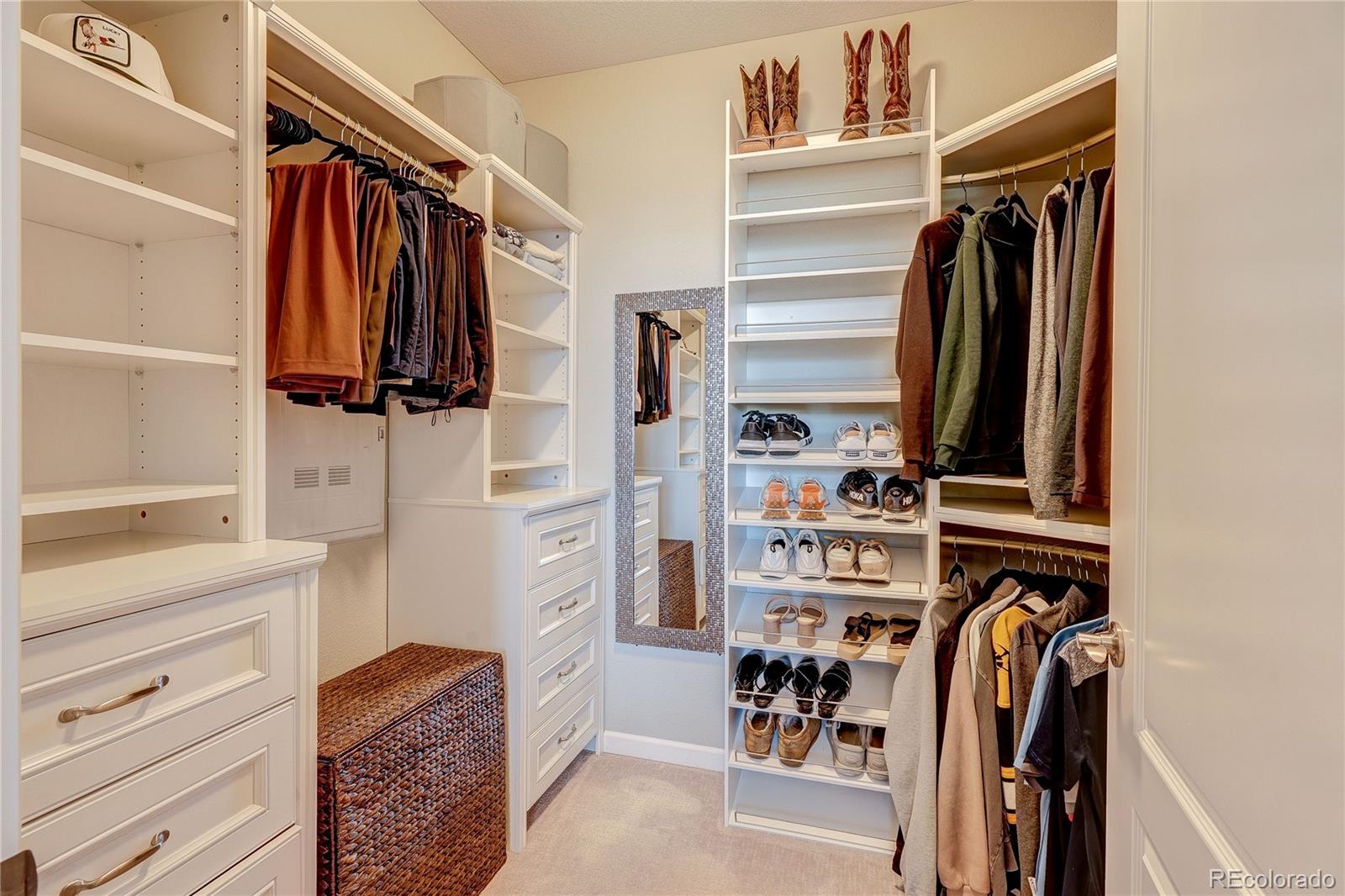 4777 Copeland Circle, Unit 204 Highlands Ranch, CO 80126 - Photo 18 of 39 a view of walk in closet with clothes and shoes