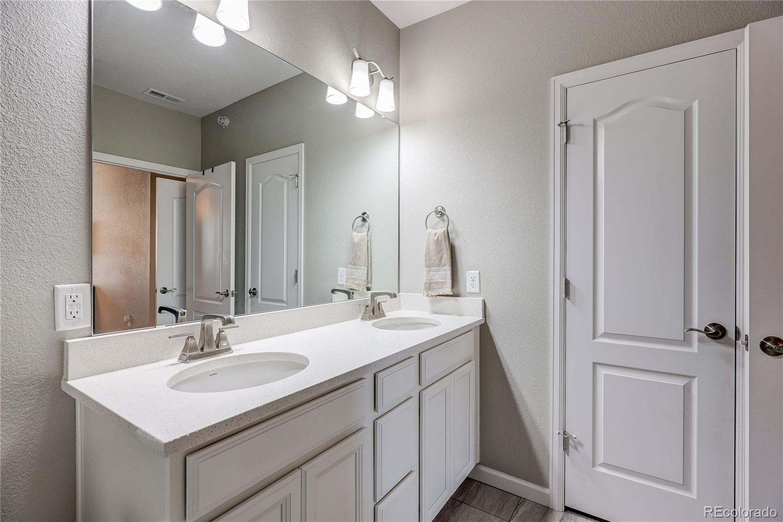 4777 Copeland Circle, Unit 204 Highlands Ranch, CO 80126 - Photo 19 of 39 a bathroom with a sink and a mirror