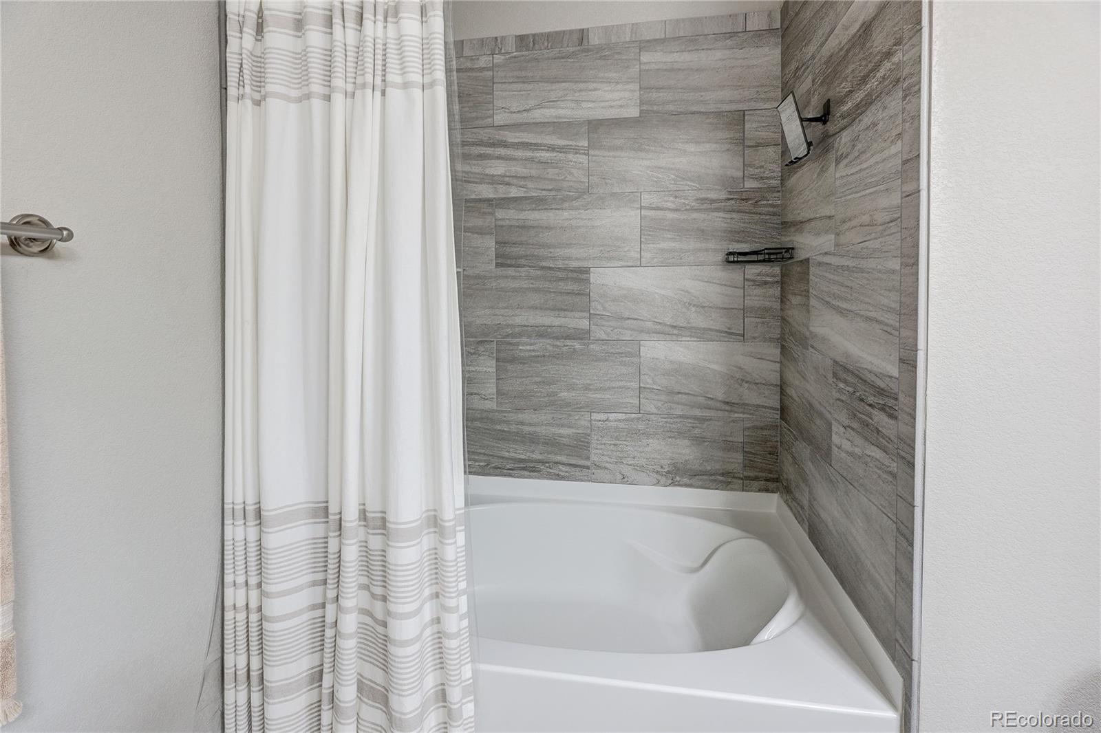 4777 Copeland Circle, Unit 204 Highlands Ranch, CO 80126 - Photo 20 of 39 a close up of a bathtub curtain