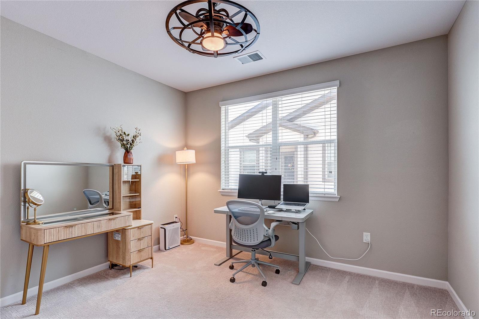 4777 Copeland Circle, Unit 204 Highlands Ranch, CO 80126 - Photo 21 of 39 a view of a workspace with furniture and a window