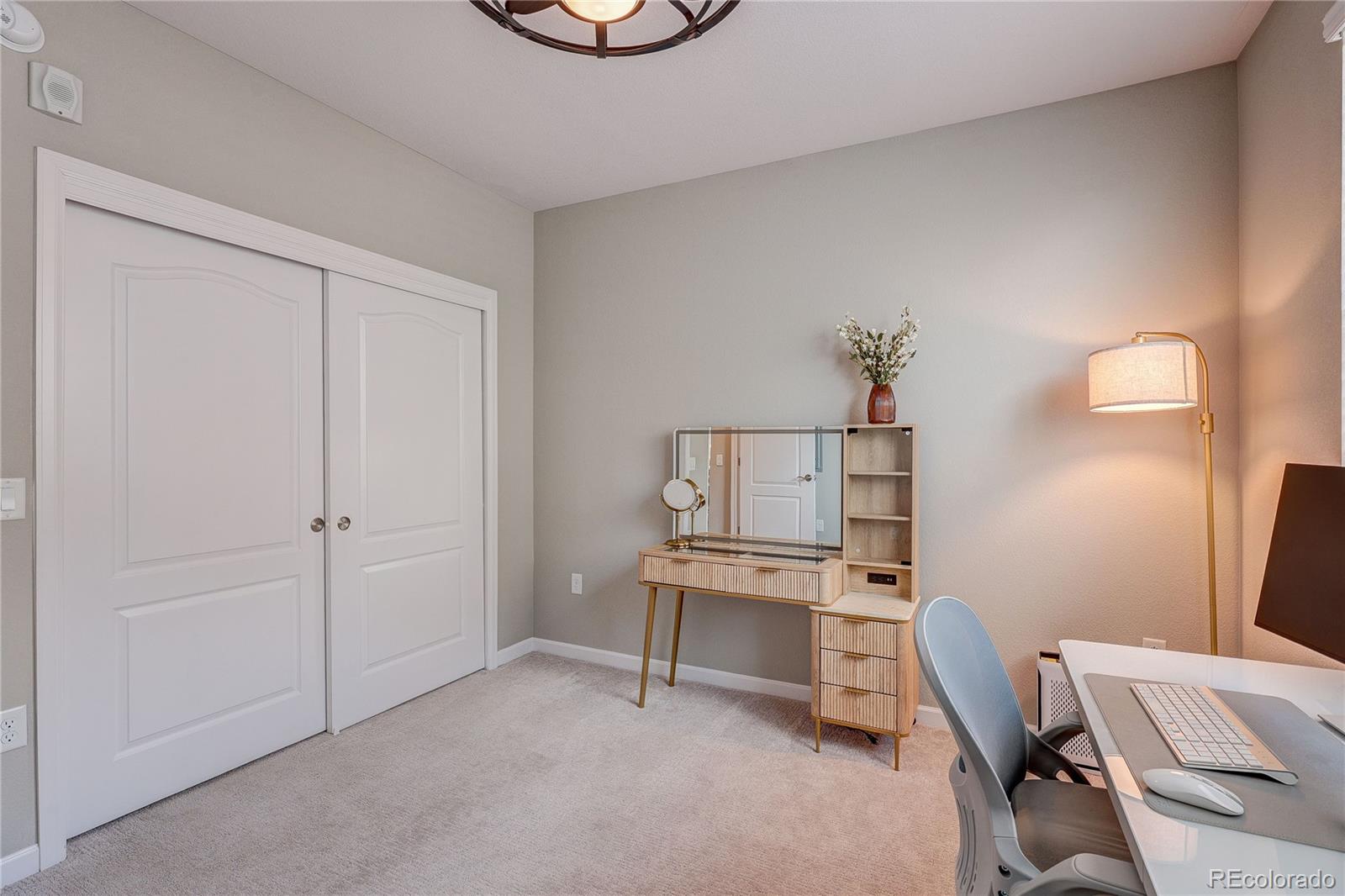 4777 Copeland Circle, Unit 204 Highlands Ranch, CO 80126 - Photo 22 of 39 a view of a workspace with furniture and a lamp