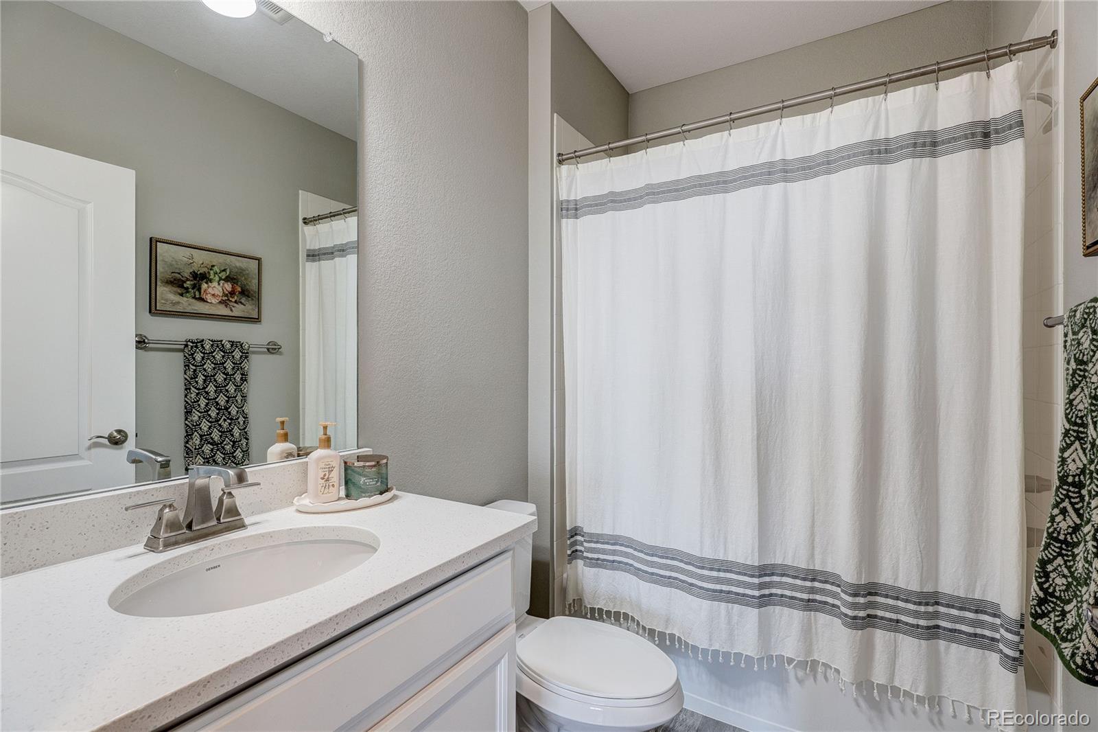 4777 Copeland Circle, Unit 204 Highlands Ranch, CO 80126 - Photo 24 of 39 a bathroom with a sink toilet and shower