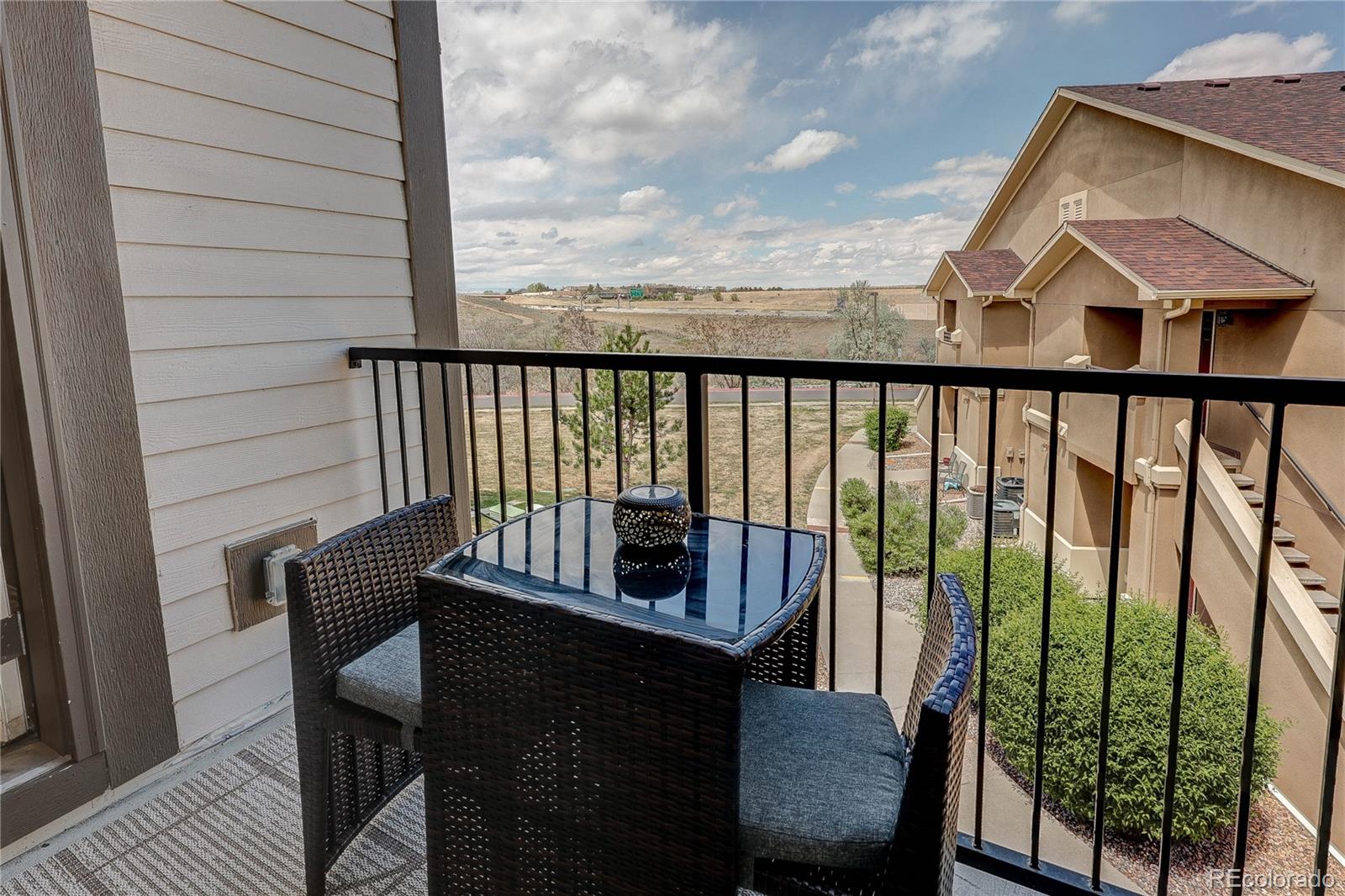 4777 Copeland Circle, Unit 204 Highlands Ranch, CO 80126 - Photo 26 of 39 a view of a chairs and table in the balcony