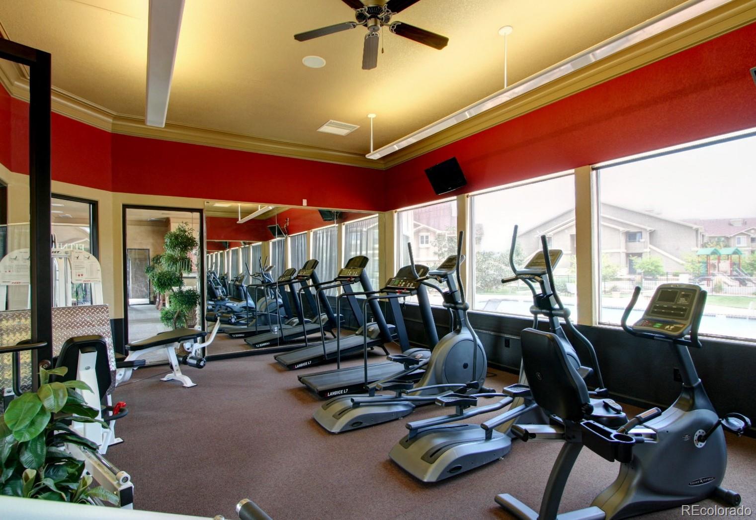 4777 Copeland Circle, Unit 204 Highlands Ranch, CO 80126 - Photo 32 of 39 a room with gym equipment and a large window