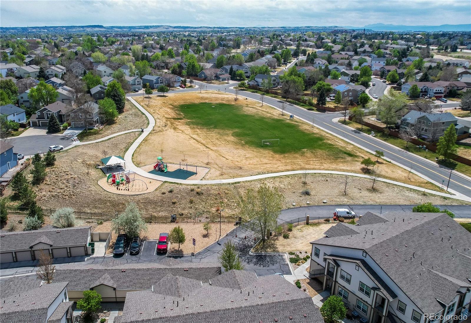 4777 Copeland Circle, Unit 204 Highlands Ranch, CO 80126 - Photo 38 of 39 an aerial view of a house with a swimming pool
