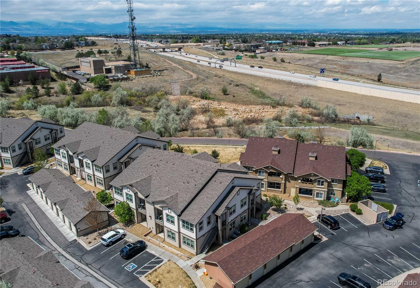 4777 Copeland Circle, Unit 204 Highlands Ranch, CO 80126 - Photo 39 of 39 an aerial view of multiple houses with a yard