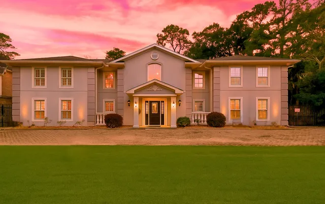 a front view of a house with a yard