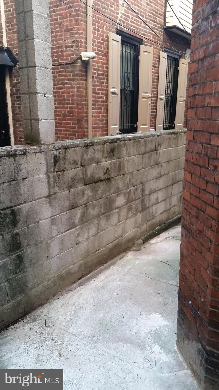 310 South 12th Street, Unit 1F Philadelphia, PA 19107 - Photo 12 of 12 a view of a brick house with a street