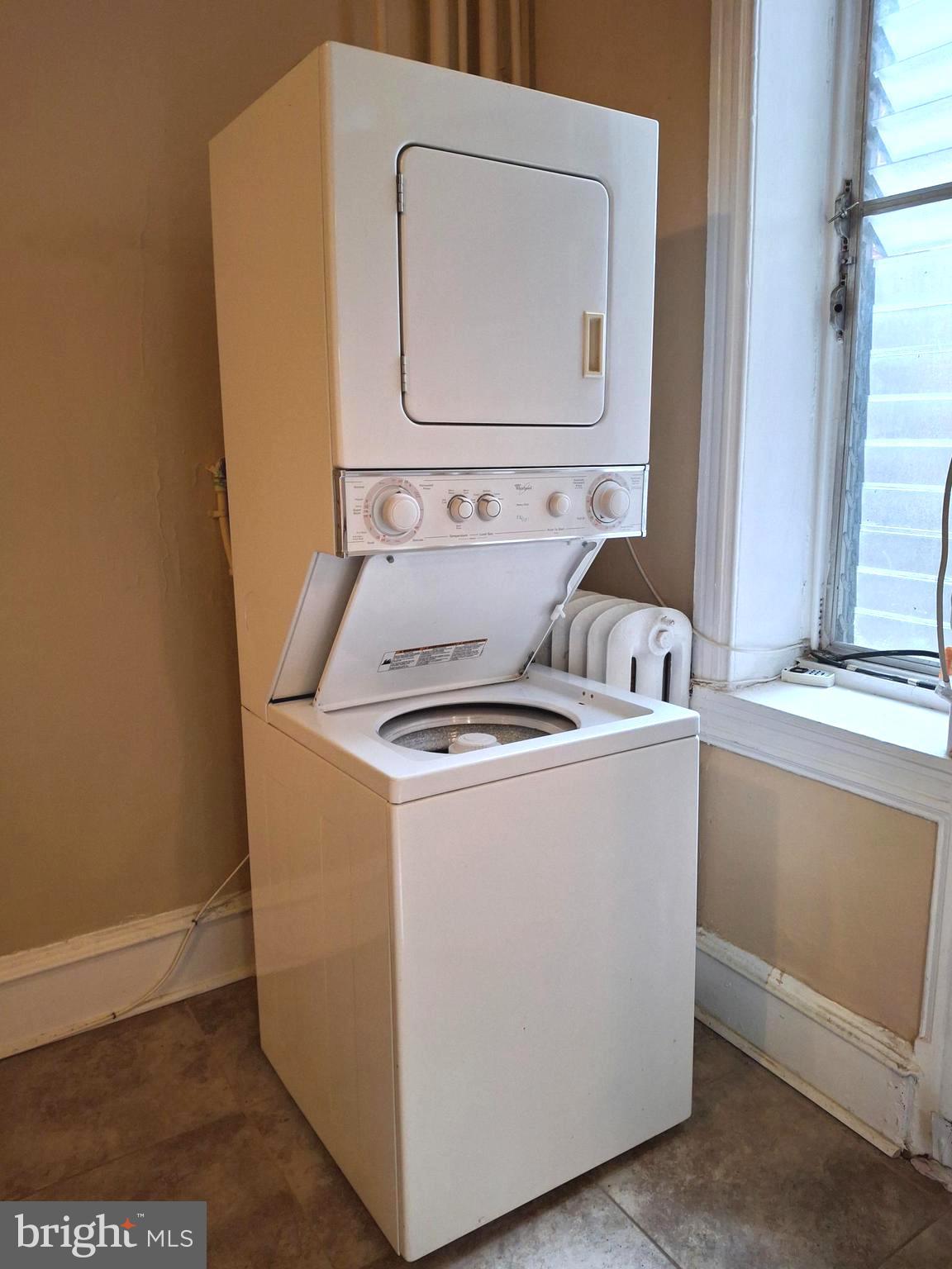 310 South 12th Street, Unit 1F Philadelphia, PA 19107 - Photo 2 of 12 a utility room with dryer and washer