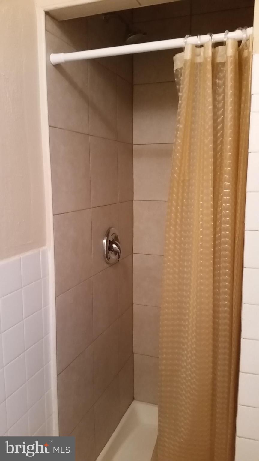 310 South 12th Street, Unit 1F Philadelphia, PA 19107 - Photo 10 of 12 a bathroom with a shower