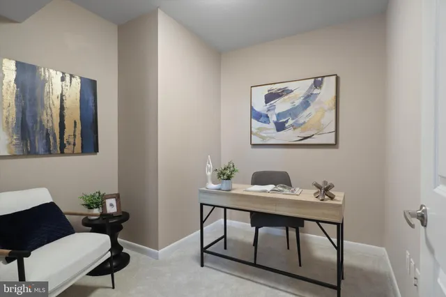 a workspace with furniture and window