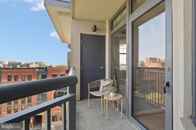 a view of a balcony with furniture